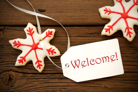 Red White Christmas Star Cookies with a Label on which stands Welcome