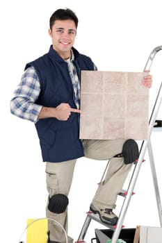 Tradesman pointing to a tile