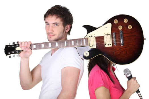 Young couple with a guitar and microphone