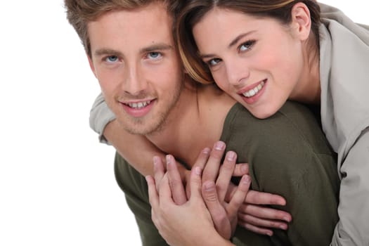 A cute couple hugging.