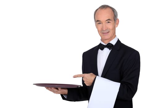 Waiter pointing to a tray