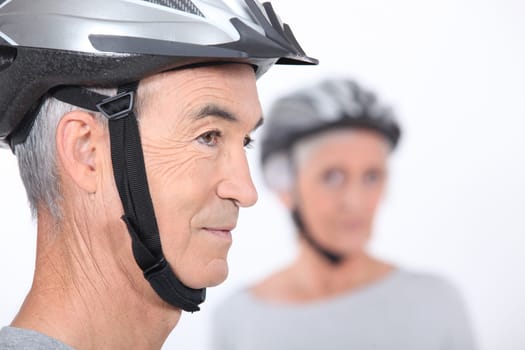 Senior man with a bicycle helmet