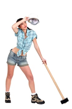 Sweating young woman with mace