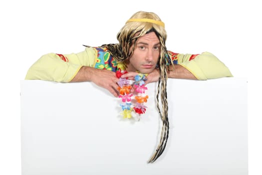 Bored man in hippie costume