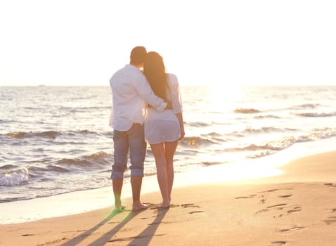 happy young romantic couple in love have fun on beautiful beach at beautiful summer day