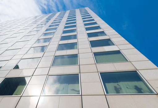 exterior of a modern skyscraper in the amsterdam business district