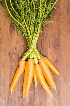 Carotene with green in portrait format on a board