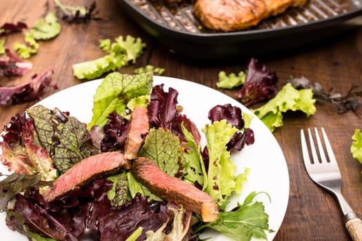 Beef entrecote and lettuce on a plate