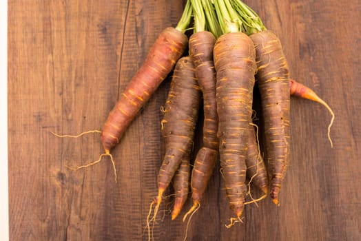 Urcarrots on a wooden board