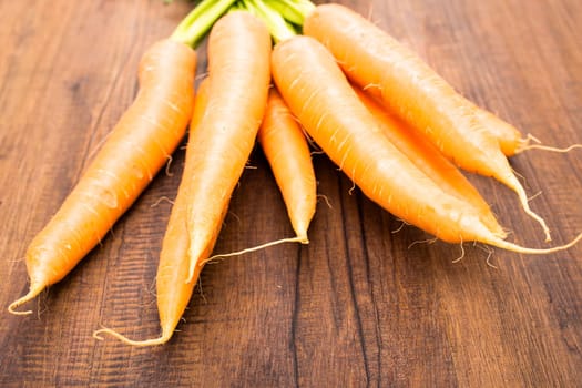 Close-up carrots on a wooden board
