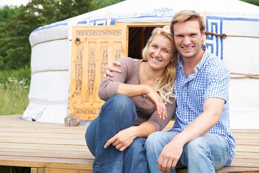 Couple Enjoying Camping Holiday In Traditional Yurt