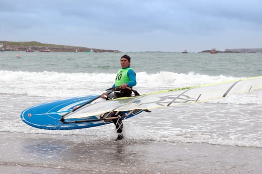 windsurfers getting ready to race and surf on the beach in the maharees county kerry ireland