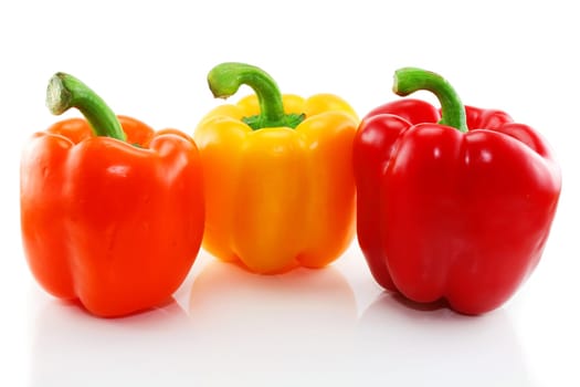 Three colored paprika isolated on a white background