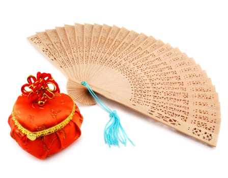 Wood pan and orange heart-form case isolated on a white background