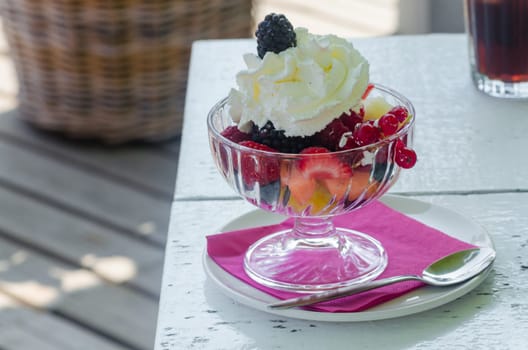 Fruit salad is made from marinated fresh fruit. The dessert consists of small-cut fresh fruit pieces.