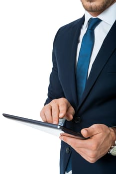 Businessman with a tablet computer touchscreen with his finger while surfing close-up from hands and tablet isolated on white background