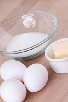 Baking ingredients in the kitchen me eggs,flour,butter and sugar to stir a dough and bake a cake