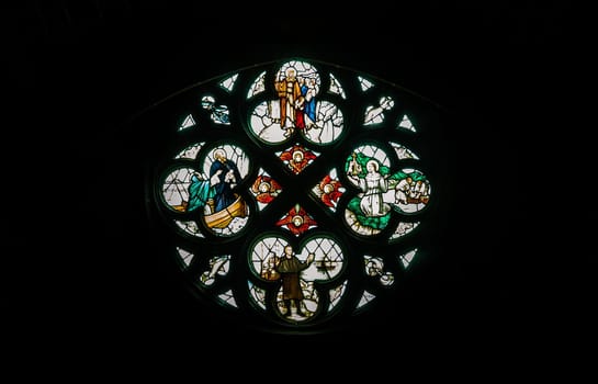 Liverpool, England - Oct 07, 2023 - Silhouette of Stained glass window, Pattern of Medieval gothic rose window in Liverpool cathedral, Inside view, Space for text, Selective focus.