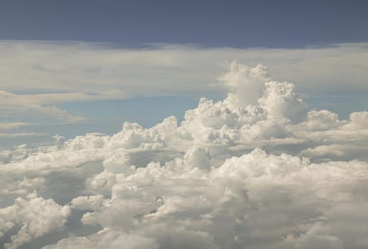 The softness of the clouds and sky with the light shining from the sun. Concept idea of Imaginative clouds nature, Clouds view from airplane, Space for text, No focus, specifically.