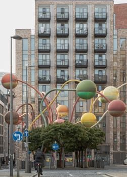 Liverpool, UK - Oct 09, 2023 - The penelope sculpture at Wolstenholme square's famous at Gradwell Street, Abstract of different coloured spheres at the end of poles twisting at different heights and directions, Merseyside, Space for text, Selective focus.