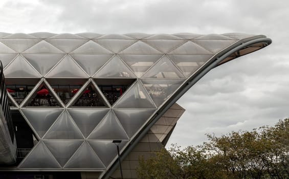 London, England - Oct 16, 2023 - The Lattice Roof structure of Crossrail Place at Canary Wharf. View of Canary Wharf Station Cross Rail, One of the longest contiguous wooden roofs was used, Space for text, Selective focus.