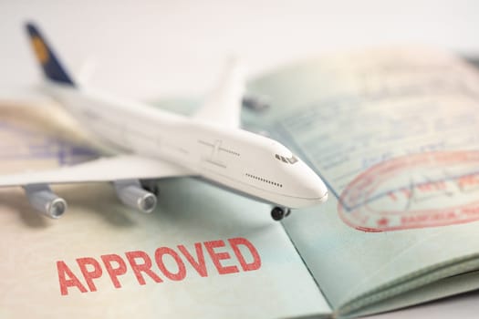 Approved Stamp visa and passport document to immigration at airport in country.