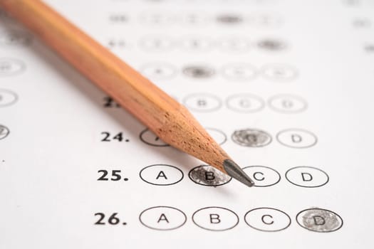 Answer sheets with pencil drawing fill to select choice, education concept.