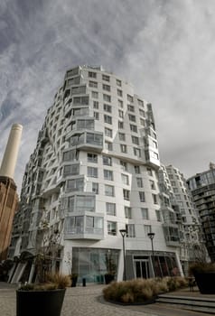 London, UK - Oct 16, 2023 - Facade Residential luxury apartment buildings at Battersea near to Battersea Power Station. Modern apartment battersea buildings complex with balconies and architectural structure, Design urban geometry.