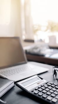 Accountant's Office. Calculator, Laptop, Glasses on Desk Panoramic Banner, Finance, Business, Accounting Concept.