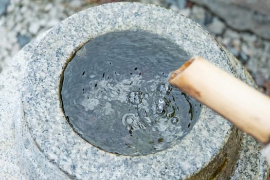Water ladle and basin for cleansing at shrine in Kyoto, Japan