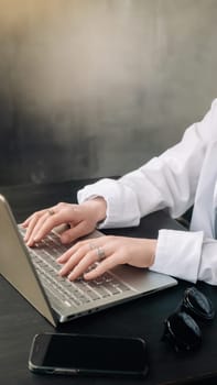 Professional Businesswoman Analyzing Strategy in Office. Laptop and Workroom Scene. Business woman professional work in the office, analyzing business strategy, woman use a laptop in the workroom