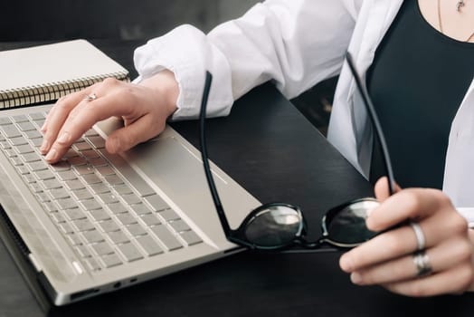 Productive Work Environment. Female Hands Typing on Laptop Keyboard, Embracing Online Learning, Internet Marketing, and Freelancing from Home.