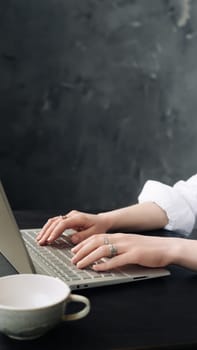 Young Woman Balancing Work and Study: Laptop Use at Home Office, Freelance, Business, Lifestyle Concept. Young Woman Engaged in Office Work on Laptop: WFH and Freelance Lifestyle.