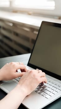 Productive Workspace. Woman's Hands Typing on Laptop Keyboard, Balancing Work and Learning at Office, Embracing Online Learning, Internet Marketing, Freelancing, and Work from Home Concept.