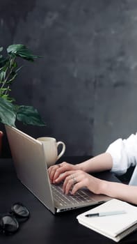 Close-Up of Woman's Hands Typing on Laptop. Online Learning, Internet Marketing, Work from Home, Freelance, Office Workplace Concept. Woman hands typing on computer keyboard closeup.