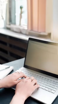 Young Woman with Laptop Mockup. Business, Freelance, Student Life, E-Learning, Technology, Online Shopping Woman using laptop computer with empty blank mockup screen. Business woman working in office.