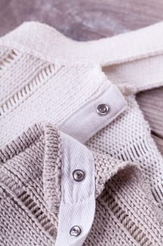 Close-up of a bright fabric tructure knitted from wool background
