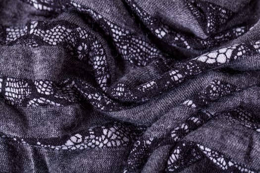 grey antrazite coloured fabric made of wool cotton with lace texture as close-up