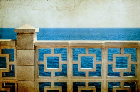 View to the sea from a classic white balcony - vintage photo