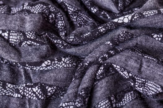 grey antrazite coloured fabric made of wool cotton with lace texture as close-up