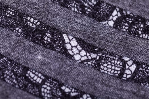 grey antrazite coloured fabric made of wool cotton with lace texture as close-up