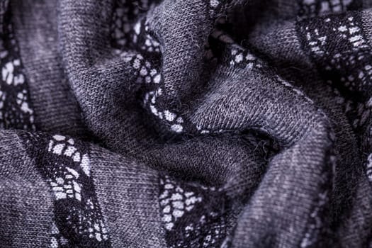 grey antrazite coloured fabric made of wool cotton with lace texture as close-up