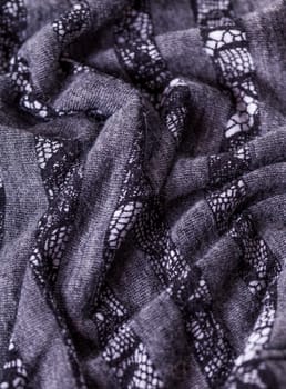 grey antrazite coloured fabric made of wool cotton with lace texture as close-up