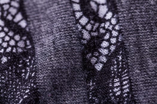 grey antrazite coloured fabric made of wool cotton with lace texture as close-up