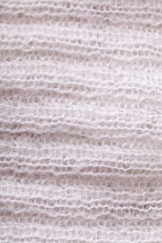 White knitted fabric wool with structure fluffy soft as close-up
