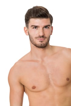 attractive muscular young man with free torso and beard isolated against white background