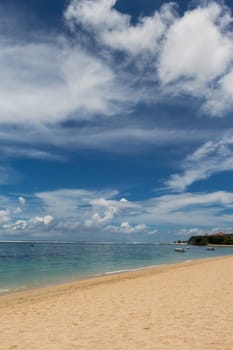 Beautiful secluded sandy beach in the Caribbean with white sand and blue sky as in paradise
