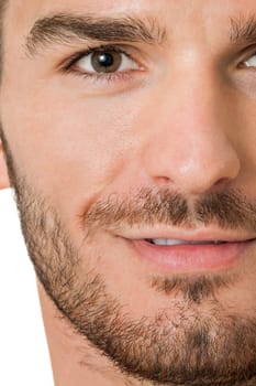 attractive muscular young man with free torso and beard isolated against white background