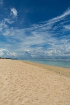 Beautiful secluded sandy beach in the Caribbean with white sand and blue sky as in paradise