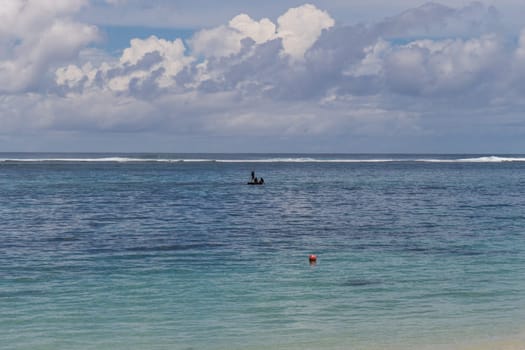 Beautiful secluded sandy beach in the Caribbean with white sand and blue sky as in paradise